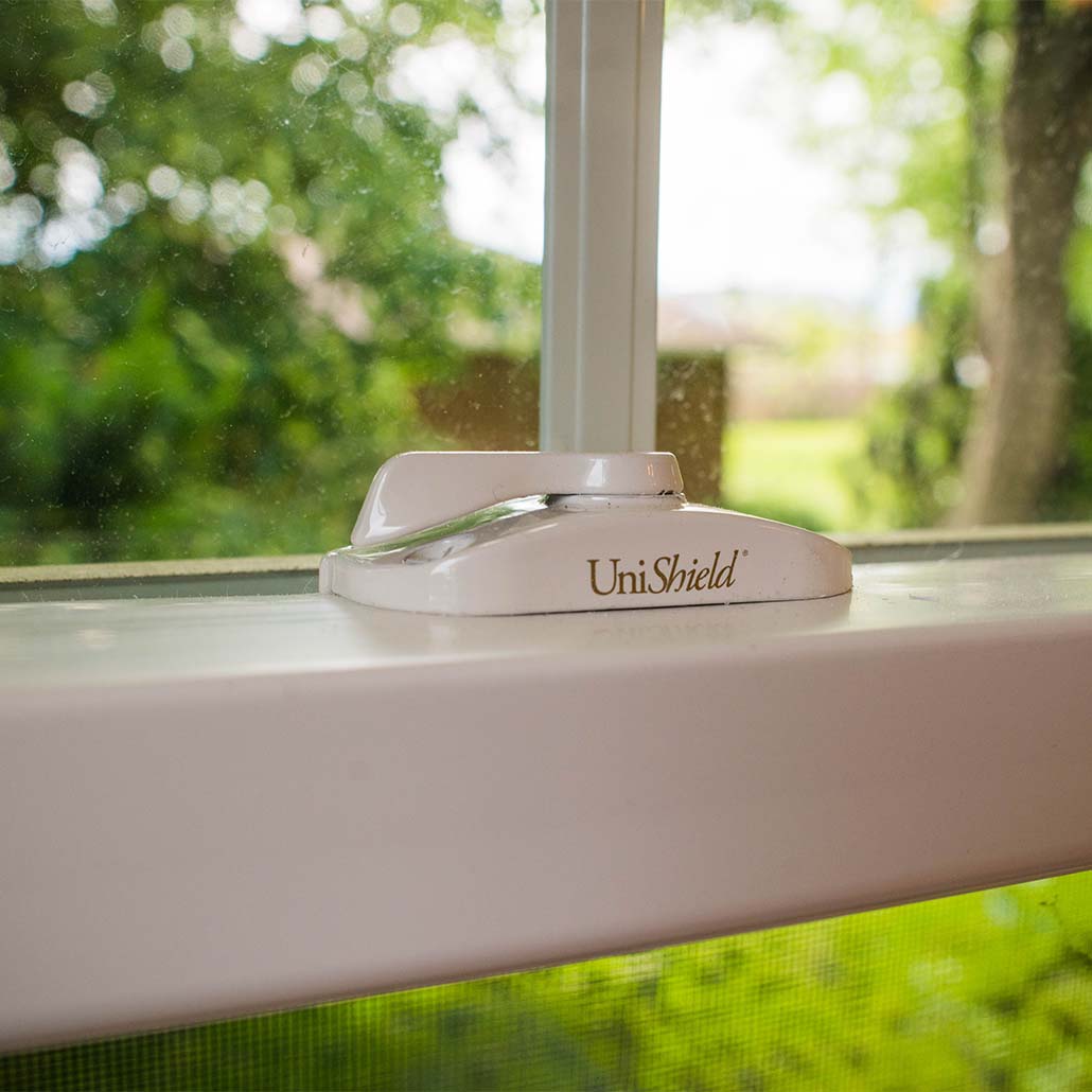 A cam lock on a UniShield window
